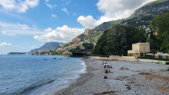 Beautiful beach in Roquebrune-Cap-Martin. Monaco in the distance